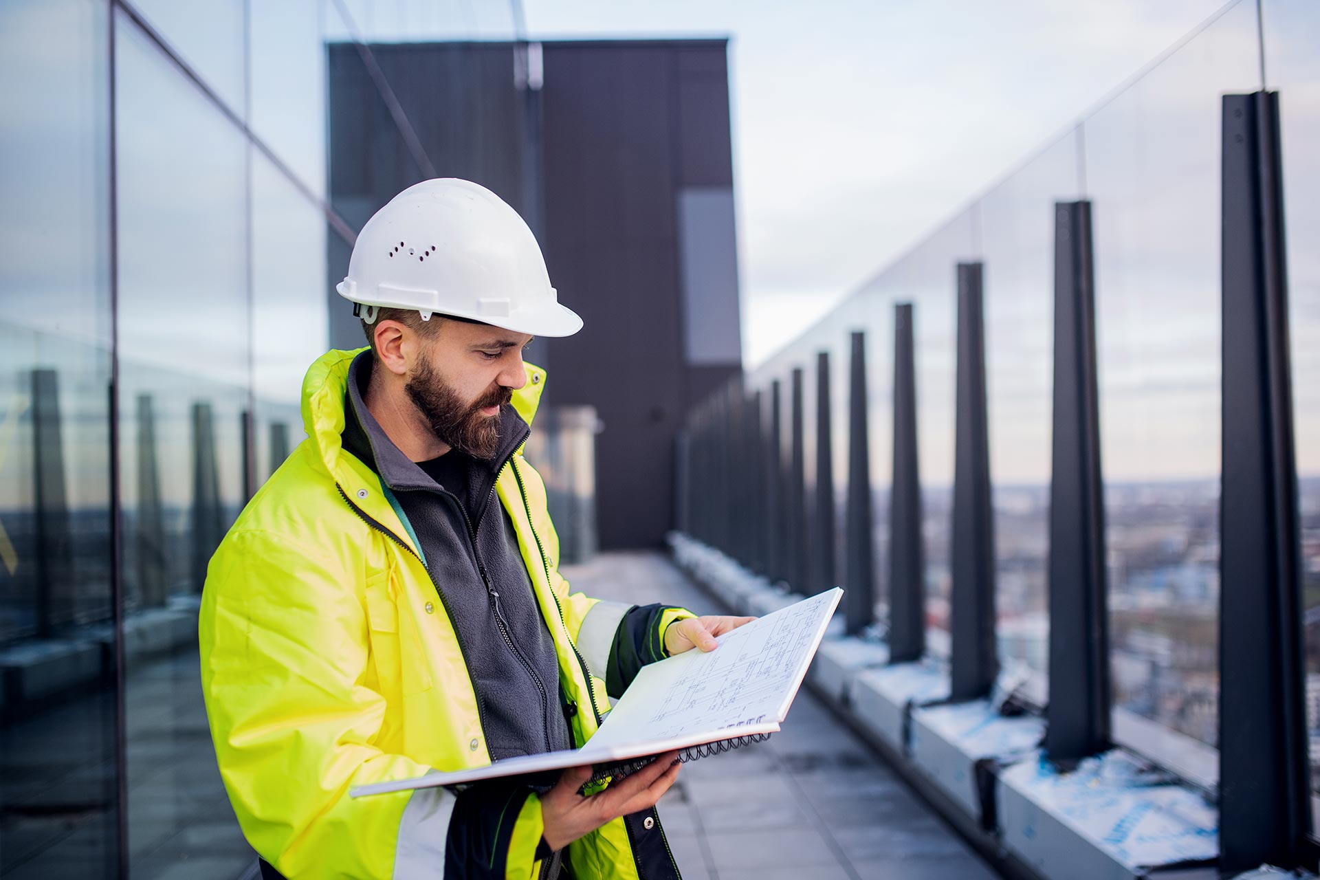 man-engineer-standing-on-construction-site-holdin-2022-02-02-04-50-37-utc.jpg